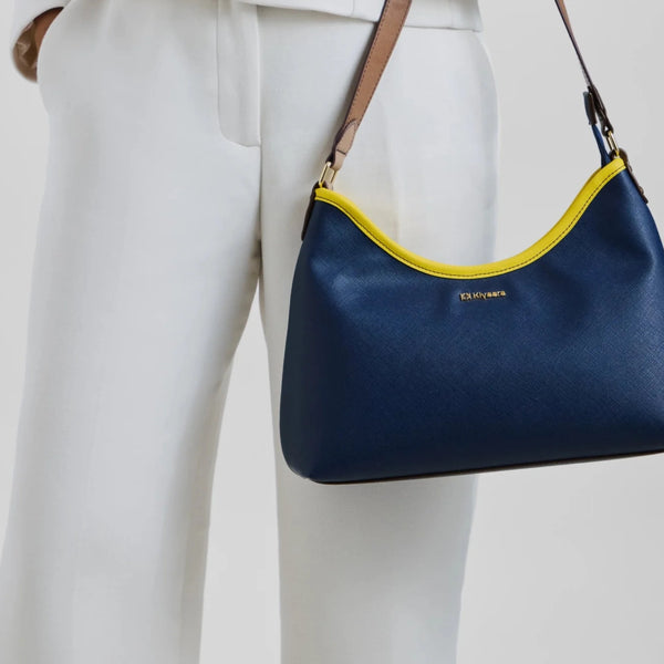 Clean lines and a softly textured finish make even simple outfits feel polished.