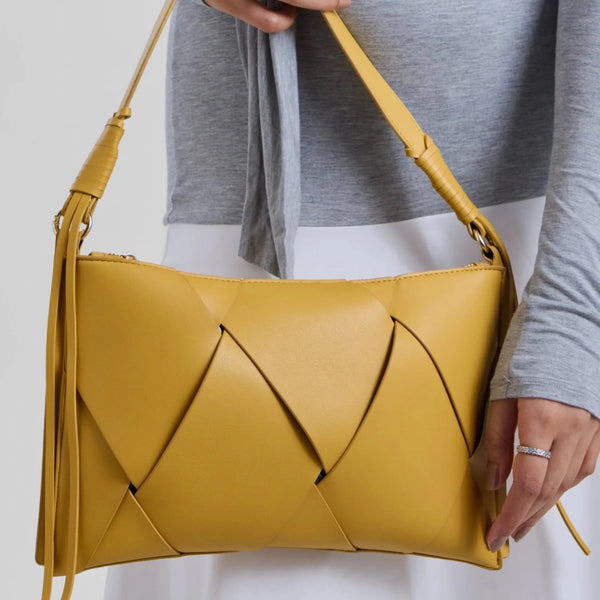 Slim, lightweight shape makes it easy to carry from brunch to evening plans.