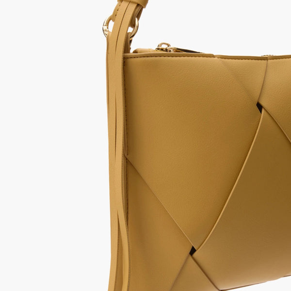Criss-cross details and playful tassels add personality to even the simplest outfit.