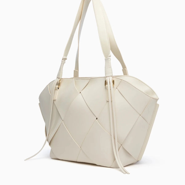 Soft vegan leather with a structured build stays upright, even when full.